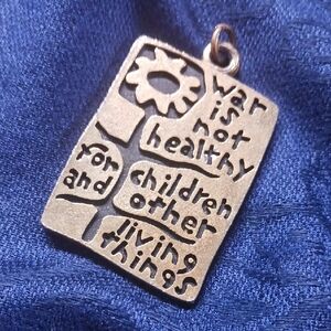 Vintage War Is Not Healthy Pendant.
